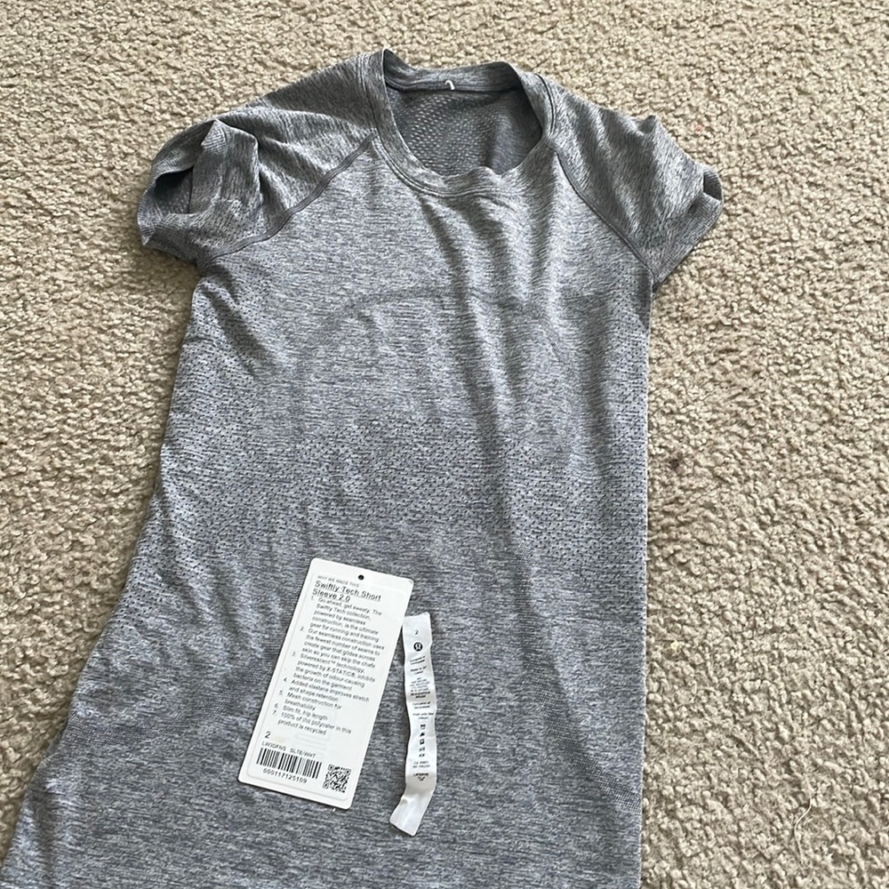 Lululemon Swiftly Tech in Slate/ White! Size 2 (didn’t fit me!) Bought for $74.